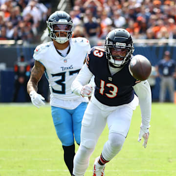 Sep 8, 2024; Chicago, Illinois, USA; Chicago Bears wide receiver Keenan Allen (13) attempts to make a catch against Tennessee Titans safety Amani Hooker (37) during the second half at Soldier Field. Mandatory Credit: Mike Dinovo-Imagn Images