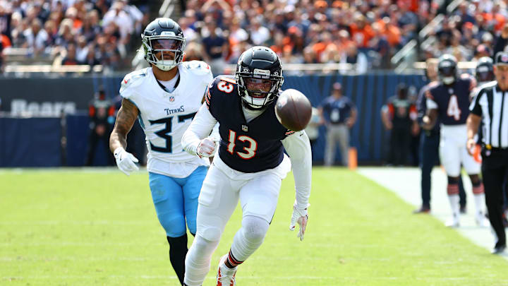 Sep 8, 2024; Chicago, Illinois, USA; Chicago Bears wide receiver Keenan Allen (13) attempts to make a catch against Tennessee Titans safety Amani Hooker (37) during the second half at Soldier Field. Mandatory Credit: Mike Dinovo-Imagn Images