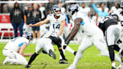 Oct 12, 2025; Paradise, Nevada, USA; Tennessee Titans Matthew Wright (14) punts the ball during the second half against the Las Vegas Raiders at Allegiant Stadium. Mandatory Credit: Stephen R. Sylvanie-Imagn Images