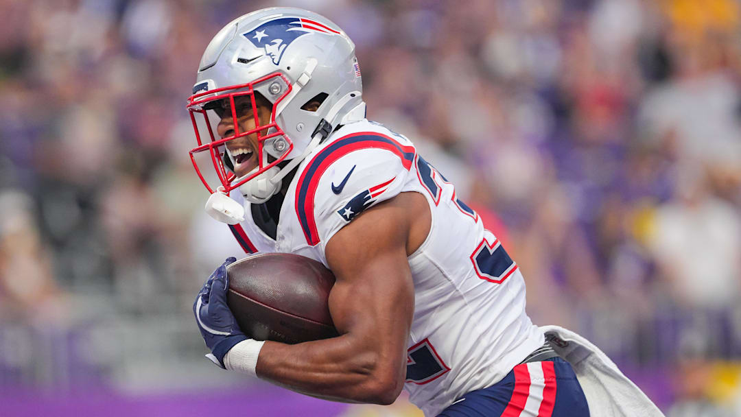 New England Patriots running back TreVeyon Henderson (32) celebrates his touchdown against the Minnesota Vikings in the first quarter at U.S. Bank Stadium.