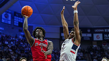 Feb 7, 2025; Storrs, Connecticut, USA; St. John's basketball guard Kadary Richmond (1) shoots the ball against UConn Huskies center Tarris Reed Jr. (5) in the second half at Harry A. Gampel Pavilion.