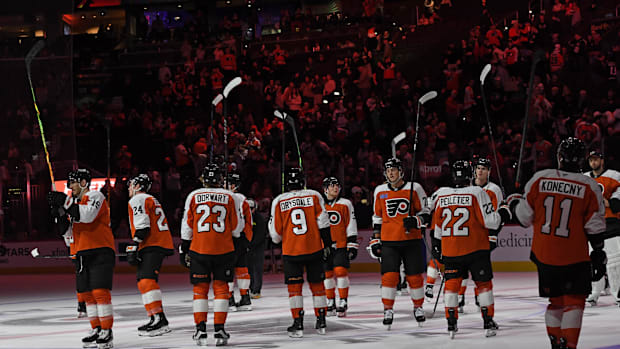 Philadelphia Flyers players salute the fans after loss to the Columbus Blue Jackets at Wells Fargo Center