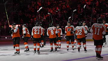 Apr 15, 2025; Philadelphia, Pennsylvania, USA; Philadelphia Flyers players salute the fans after loss to the Columbus Blue Jackets at Wells Fargo Center.