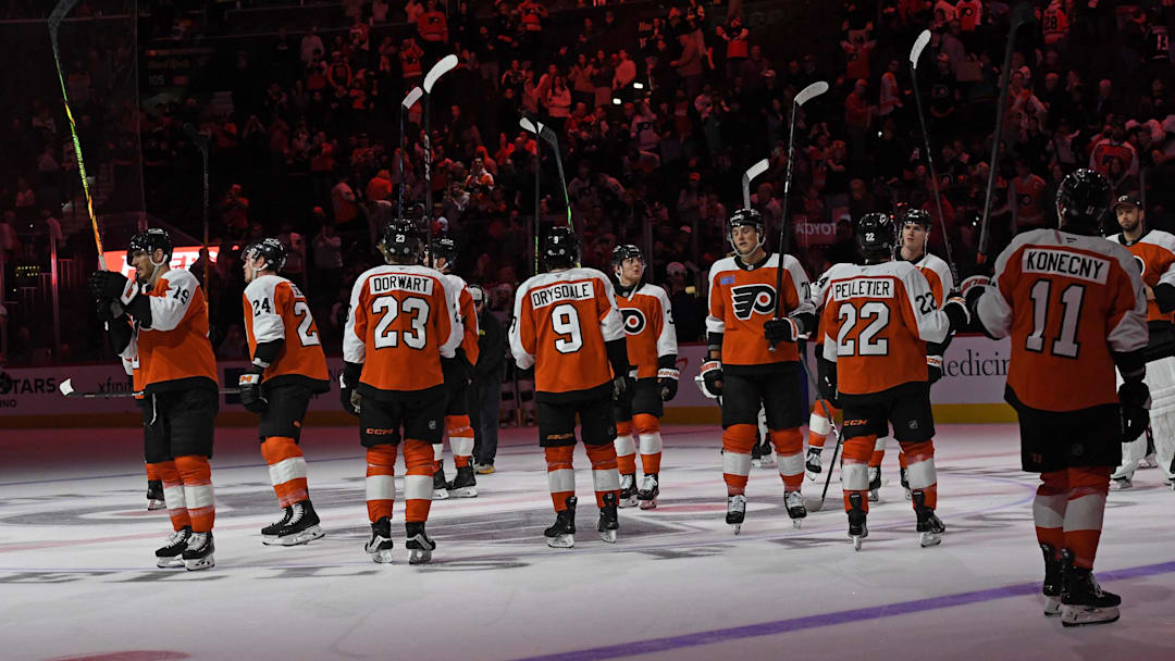Apr 15, 2025; Philadelphia, Pennsylvania, USA; Philadelphia Flyers players salute the fans after loss to the Columbus Blue Jackets at Wells Fargo Center. Mandatory Credit: Eric Hartline-Imagn Images
