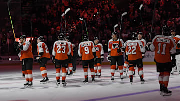 Apr 15, 2025; Philadelphia, Pennsylvania, USA; Philadelphia Flyers players salute the fans after loss to the Columbus Blue Jackets at Wells Fargo Center. Mandatory Credit: Eric Hartline-Imagn Images