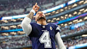Dallas Cowboys quarterback Dak Prescott prays before the game against the Detroit Lions at AT&T Stadium.