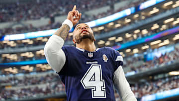 Dallas Cowboys quarterback Dak Prescott prays before the game against the Detroit Lions at AT&T Stadium.
