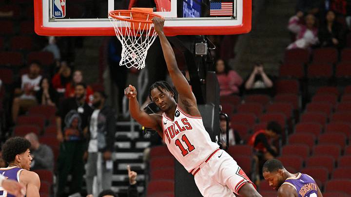Oct 7, 2026; Chicago, Illinois, USA;  Chicago Bulls forward Leonard Miller (11) dunks the ball against the Phoenix Suns during the second half at United Center.  Mandatory Credit: Patrick Gorski-Imagn Images