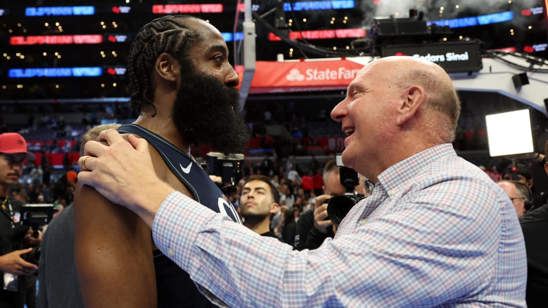 Los Angeles, California, USA;  L.A. Clippers guard James Harden (1, left) is greeted by owner Steve Ballmer after defeating Houston Rockets 106-100 at Crypto.com Arena. Mandatory Credit: