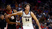 Georgia Bulldogs forward RJ Godfrey (10) and Gonzaga Bulldogs forward Braden Huff (34) fight for a rebound in the second half of a first round men’s NCAA Tournament game at Intrust Bank Arena