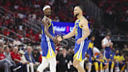 Golden State Warriors guard Stephen Curry (30) celebrates with forward Jimmy Butler III.