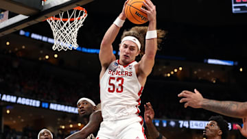 Nebraska forward Josiah Allick collects a rebound over Texas A&M guard Tyrece Radford during the 2024 NCAA Tournament.