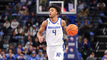 Feb 23, 2025; Memphis, Tennessee, USA; Memphis Tigers guard PJ Haggerty (4) dribbles against the Florida Atlantic Owls during the first half at FedExForum. Mandatory Credit: Wesley Hale-Imagn Images