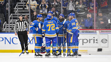 Jan 11, 2025; St. Louis, Missouri, USA;  St. Louis Blues defenseman Colton Parayko (55) is congratulated by teammates after scoring against the Columbus Blue Jackets during the third period at Enterprise Center. Mandatory Credit: Jeff Curry-Imagn Images