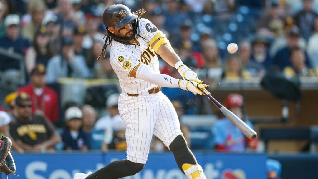 May 9, 2026; San Diego, California, USA; San Diego Padres right fielder Fernando Tatis Jr. (23) hits a broken bat 2-RBI single during the fifth inning against the St. Louis Cardinals at Petco Park. Mandatory Credit: David Frerker-Imagn Images