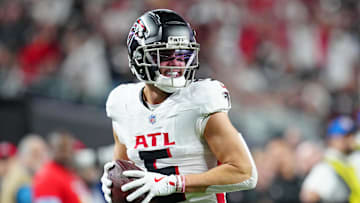 Dec 16, 2024; Paradise, Nevada, USA; Atlanta Falcons wide receiver Drake London (5) celebrates after scoring a touchdown against the Las Vegas Raiders during the first quarter at Allegiant Stadium. Mandatory Credit: Stephen R. Sylvanie-Imagn Images