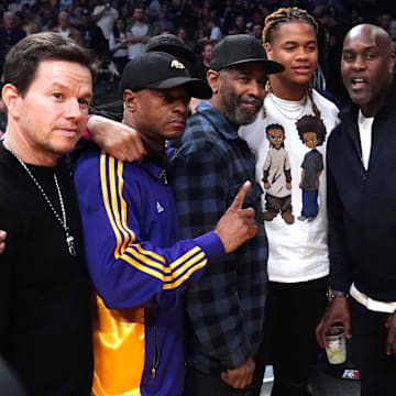 Feb 23, 2020; Los Angeles, California, USA; Film actors Denzel Washington and Mark Wahlberg  pose with NFL Prospect Chase Young, and NBA Legends Gary Payton and Baron Davis during the NBA game between the Los Angeles Lakers and the Boston Celtics at Staples Center.  Mandatory Credit: Kirby Lee-Imagn Images