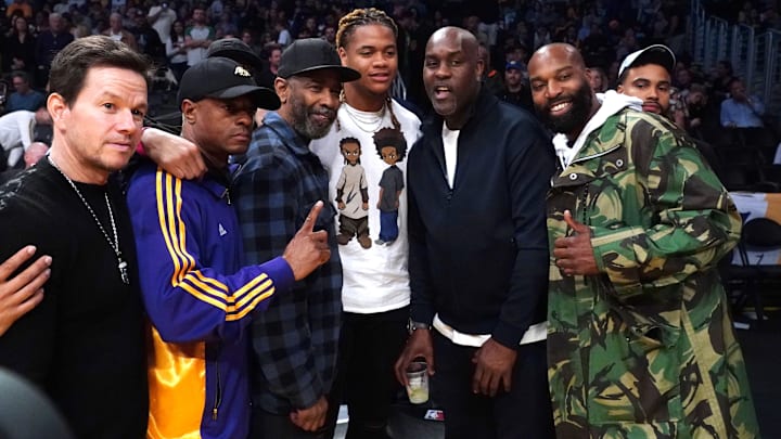 Feb 23, 2020; Los Angeles, California, USA; Film actors Denzel Washington and Mark Wahlberg  pose with NFL Prospect Chase Young, and NBA Legends Gary Payton and Baron Davis during the NBA game between the Los Angeles Lakers and the Boston Celtics at Staples Center.  Mandatory Credit: Kirby Lee-Imagn Images