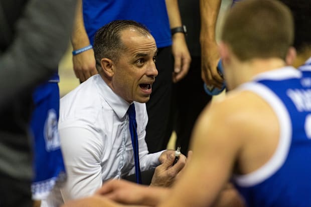 McCollum huddles with his players during a recent game.