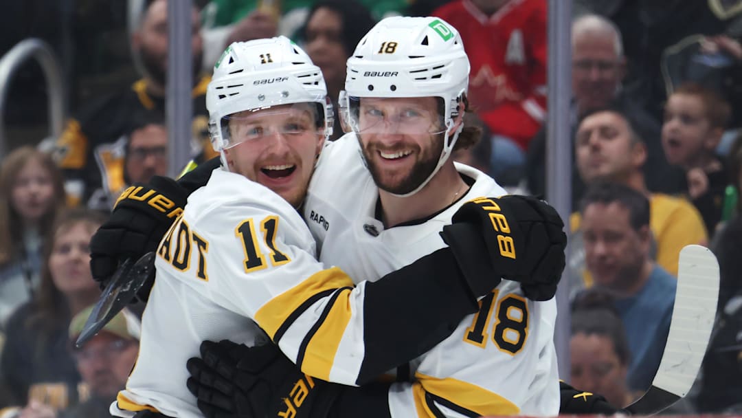 Mar 8, 2026; Pittsburgh, Pennsylvania, USA;  Boston Bruins center Casey Mittelstadt (11) congratulates center Pavel Zacha (18) on his second goal of the game against the Pittsburgh Penguins during the second period at PPG Paints Arena. Mandatory Credit: Charles LeClaire-Imagn Images