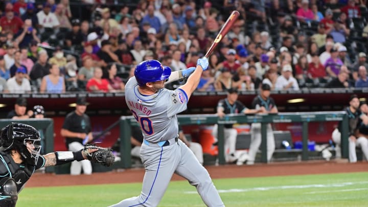 Aug 29, 2024; Phoenix, Arizona, USA;  New York Mets first baseman Pete Alonso (20) hits a solo home run in the second inning against the Arizona Diamondbacks at Chase Field. Mandatory Credit: Matt Kartozian-USA TODAY Sports