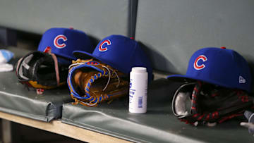 Apr 3, 2019; Atlanta, GA, USA; Detailed view of Chicago Cubs hats and gloves in the dugout against the Atlanta Braves in the fifth inning at SunTrust Park. Mandatory Credit: Brett Davis-Imagn Images
