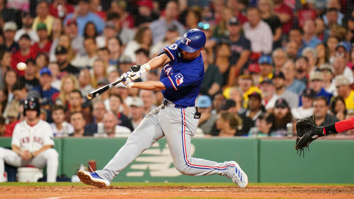 Aug 12, 2024; Boston, Massachusetts, USA; Texas Rangers shortstop Corey Seager (5) hits a two run home run against the Boston Red Sox in the seventh inning at Fenway Park. Mandatory Credit: David Butler II-USA TODAY Sports