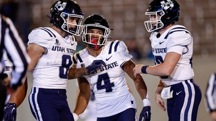 Sep 15, 2023; Colorado Springs, Colorado, USA; Utah State Aggies wide receiver Micah Davis (4) celebrates his touchdown with wide receiver Colby Bowman (8) and quarterback McCae Hillstead (10) in the fourth quarter against the Air Force Falcons at Falcon Stadium. Mandatory Credit: Isaiah J. Downing-USA TODAY Sports