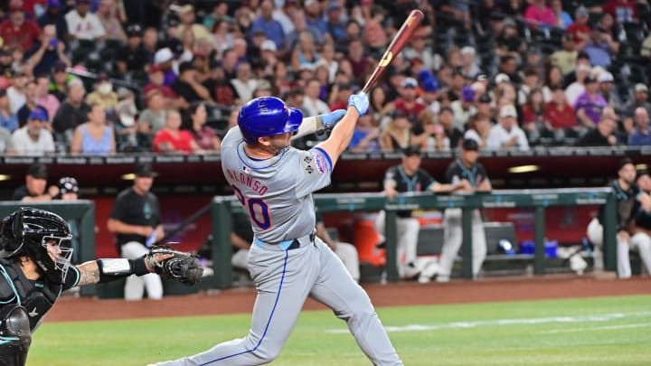 Aug 29, 2024; Phoenix, Arizona, USA;  New York Mets first base Pete Alonso (20) hits a solo home run in the second inning against the Arizona Diamondbacks at Chase Field.