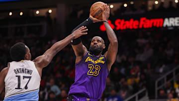 Dec 6, 2024; Atlanta, Georgia, USA; Los Angeles Lakers forward LeBron James (23) shoots over Atlanta Hawks forward Onyeka Okongwu (17) in the second quarter at State Farm Arena. Mandatory Credit: Brett Davis-Imagn Images