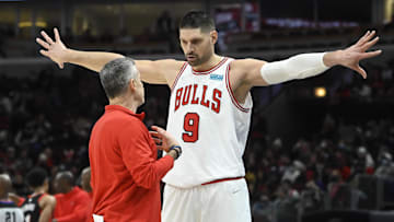 Jan 30, 2022; Chicago, Illinois, USA;  Chicago Bulls center Nikola Vucevic (9) talks with Chicago Bulls head coach Billy Donovan during the first half at the United Center. Mandatory Credit: Matt Marton-Imagn Images