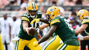 Aug 10, 2024; Cleveland, Ohio, USA; Green Bay Packers quarterback Jordan Love (10) hands off to running back Josh Jacobs (8) during the first half against the Cleveland Browns at Cleveland Browns Stadium. Mandatory Credit: Ken Blaze-Imagn Images