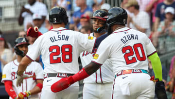 Atlanta Braves first baseman Matt Olson (28) celebrates with shortstop Orlando Arcia (11) and designated hitter Marcell Ozuna (20) after a two-run home run against the Miami Marlins in the first inning at Truist Park on Aug. 1.