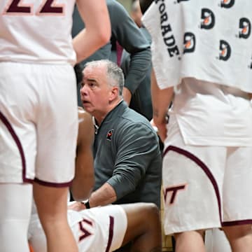 Mar 1, 2025; Virginia Tech head coach Mike Young talks to his team during a timeout.