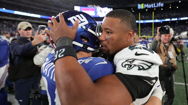 New York Giants running back Cam Skattebo (44) and Philadelphia Eagles running back Saquon Barkley 