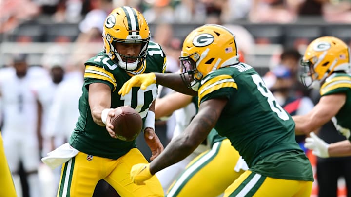 Aug 10, 2024; Cleveland, Ohio, USA; Green Bay Packers quarterback Jordan Love (10) hands off to running back Josh Jacobs (8) during the first half against the Cleveland Browns at Cleveland Browns Stadium. Mandatory Credit: Ken Blaze-Imagn Images