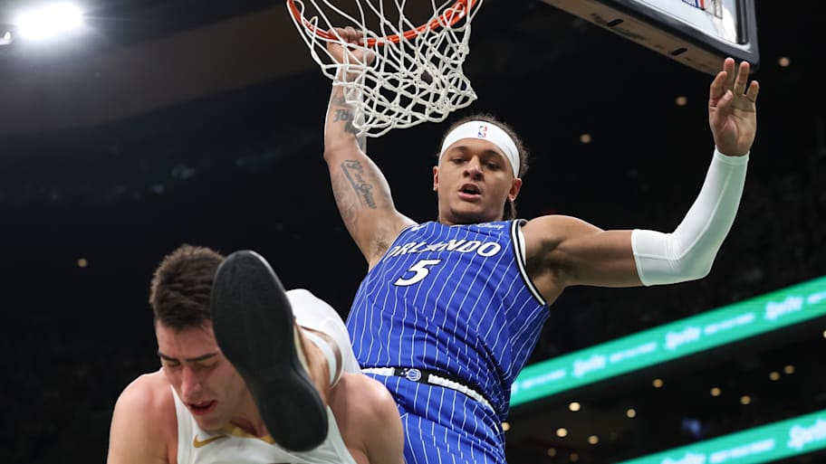Orlando Magic forward Paolo Banchero dunks the ball against the Boston Celtics.