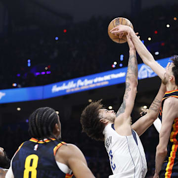 May 15, 2024; Oklahoma City, Oklahoma, USA; Oklahoma City Thunder forward Chet Holmgren (7) blocks a shot by Dallas Mavericks center Dereck Lively II (2) during the second half of game five of the second round for the 2024 NBA playoffs at Paycom Center. Mandatory Credit: Alonzo Adams-Imagn Images