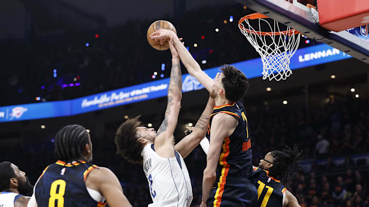 May 15, 2024; Oklahoma City, Oklahoma, USA; Oklahoma City Thunder forward Chet Holmgren (7) blocks a shot by Dallas Mavericks center Dereck Lively II (2) during the second half of game five of the second round for the 2024 NBA playoffs at Paycom Center. Mandatory Credit: Alonzo Adams-Imagn Images