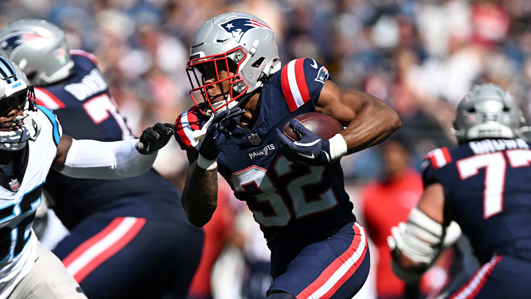Sep 28, 2025; Foxborough, Massachusetts, USA; New England Patriots running back Treveyon Henderson (32) runs against the Carolina Panthers during the first half at Gillette Stadium. Mandatory Credit: Brian Fluharty-Imagn Images