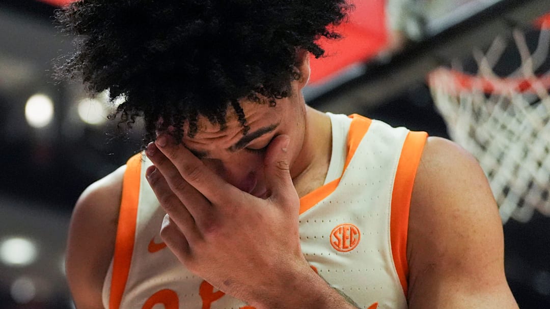 Tennessee guard Bishop Boswell (3) holds his head after taking a hit to the face during an NCAA college basketball game against Ole Miss on February 3, 2026, in Knoxville, Tennessee.