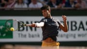 Jun 9, 2024; Paris, France; Carlos Alcaraz of Spain returns a shot during the men’s singles final against Alexander Zverev of Germany on day 15 of Roland Garros at Stade Roland Garros. Mandatory Credit: Susan Mullane-USA TODAY Sports