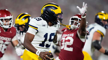 Oklahoma Sooners defensive lineman R Mason Thomas (32) chases after Michigan Wolverines quarterback Bryce Underwood (19) during a college football game between the University of Oklahoma Sooners (OU) and the University of Michigan Wolverines at Gaylord Family Ð Oklahoma Memorial Stadium in Norman, Okla., Saturday, Sept. 6, 2025. Oklahoma won 24-13.