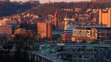 The sun sets over Downtown Cincinnati on Saturday, Nov. 18, 2023, as seen from the Scenic Overlook