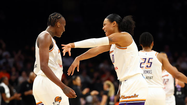 May 11, 2025; Phoenix, AZ, USA; Phoenix Mercury forward Satou Sabally (right) celebrates with forward Natasha Mack against the Golden State Valkyries during a preseason game at PHX Arena. Mandatory Credit: Mark J. Rebilas-Imagn Images