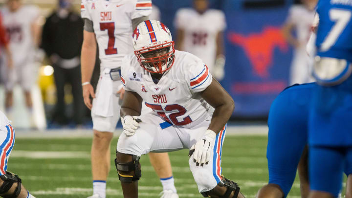 Nov 14, 2020; Tulsa, Oklahoma, USA; Southern Methodist Mustangs offensive lineman Marcus Bryant (52) gets ready to block during the game against the Tulsa Golden Hurricane at Skelly Field at H.A. Chapman Stadium. Tulsa won 28-24.