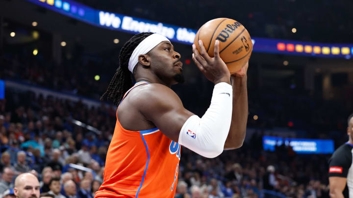 Mar 27, 2024; Oklahoma City, Oklahoma, USA; Oklahoma City Thunder guard Luguentz Dort (5) shoots a three point basket against the Houston Rockets during the first quarter at Paycom Center. Mandatory Credit: Alonzo Adams-USA TODAY Sports