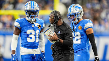 Detroit Lions defensive coordinator Aaron Glenn talks to safety Kerby Joseph (31), left, and safety Brian Branch (32) during the first half against Chicago Bears at Ford Field in Detroit on Thursday, Nov. 28, 2024.