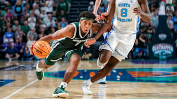 Michigan State Spartans guard Jeremy Fears Jr. (1) drives to the basket as North Carolina Tar Heels forward Caleb Wilson (8) guards him during the second half of the Fort Myers Tip-Off Beach Division game at Suncoast Credit Union Arena on Fort Myers, Fla., on Thursday, Nov. 27, 2025.