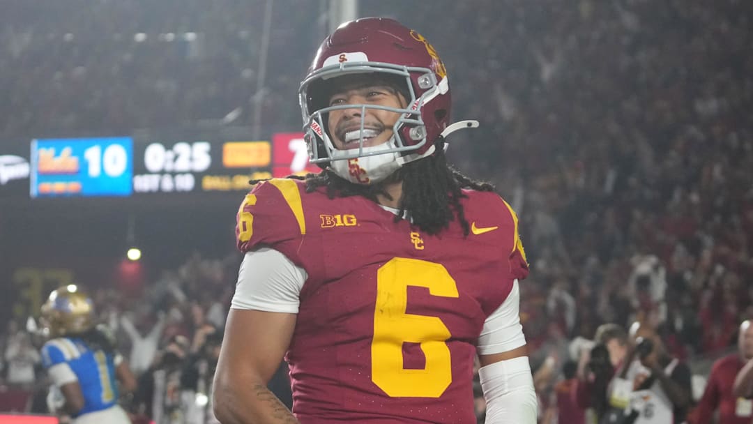 Nov 29, 2025; Los Angeles, California, USA; Southern California Trojans wide receiver Makai Lemon (6) celebrates after catching a 32-yard touchdown pass against the UCLA Bruins in the second half at United Airlines Field at Los Angeles Memorial Coliseum.  